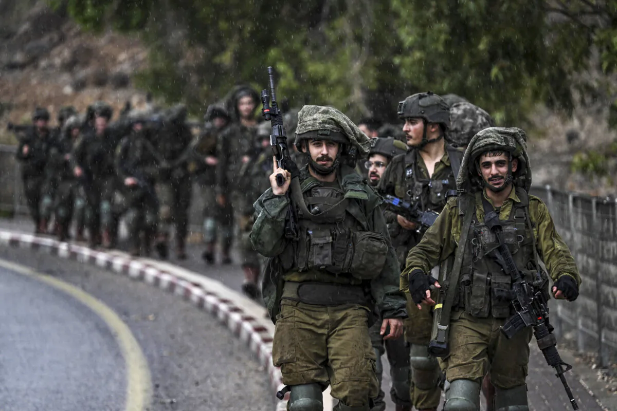 Israeli army soldiers patrol an undisclosed area in northern Israel bordering Lebanon on Oct. 15, 2023. (Aris Messinis/AFP via Getty Images)