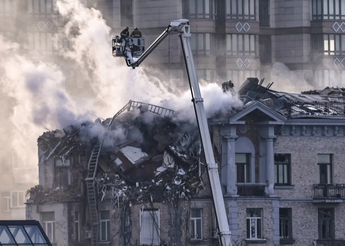 Firefighters work at the site of a building damaged during a Russian drone strike in central Kyiv, Ukraine, on Jan. 1, 2025. (Yan Dobronosov/Reuters)