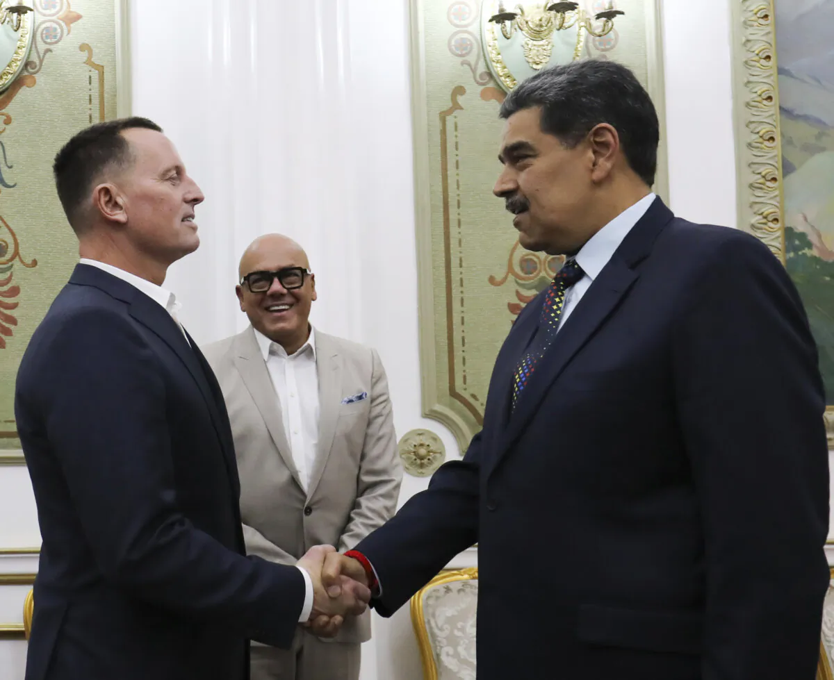 Venezuelan President Nicolás Maduro (R) shakes hands with Richard Grenell, President Donald Trump's special envoy, at Miraflores presidential palace in Caracas, Venezuela, on Jan. 31, 2025. (Venezuela's presidential press office via AP)