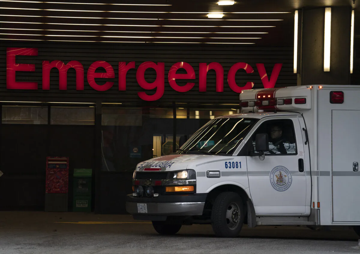 An ambulance drives past the emergency entrance of a hospital in Vancouver in a file photo. (The Canadian Press/Jonathan Hayward)