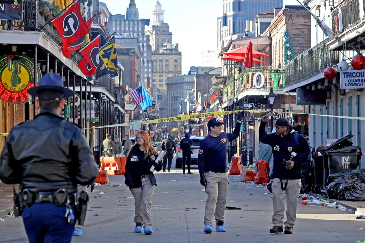 Law enforcement officers from multiple agencies work the scene on Bourbon Street after at least 14 people were killed when a person drove into the crowd in New Orleans in the early morning hours of New Year's Day, on Jan. 1, 2025. (Michael DeMocker/Getty Images)