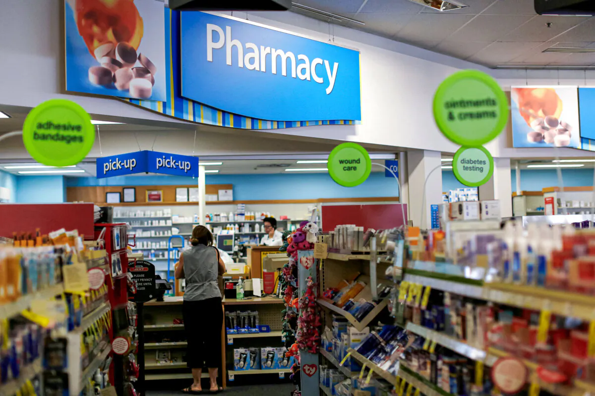 A customer waits at the counter of a CVS Pharmacy store in Pasadena, Calif., May 2, 2016. (Mario Anzuoni/Reuters)