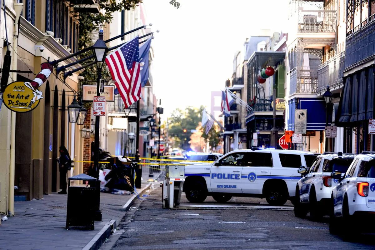 Emergency service vehicles form a security barrier to keep other vehicles out of the French Quarter after a vehicle drove into a crowd on New Orleans' Canal and Bourbon Street on Jan. 1, 2025. (Gerald Herbert/AP Photo)