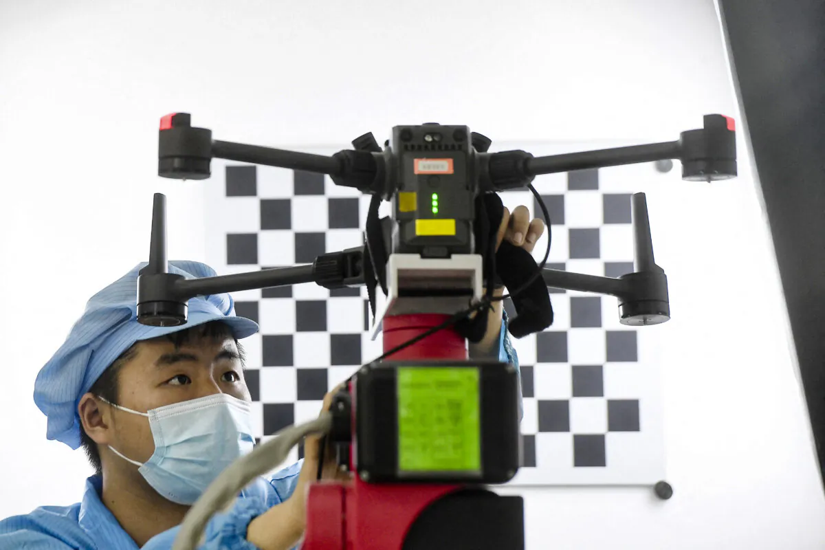 A worker produces drones at a factory in Wuhan, Hubei Province, China, on April 13, 2023. (STR/AFP via Getty Images)