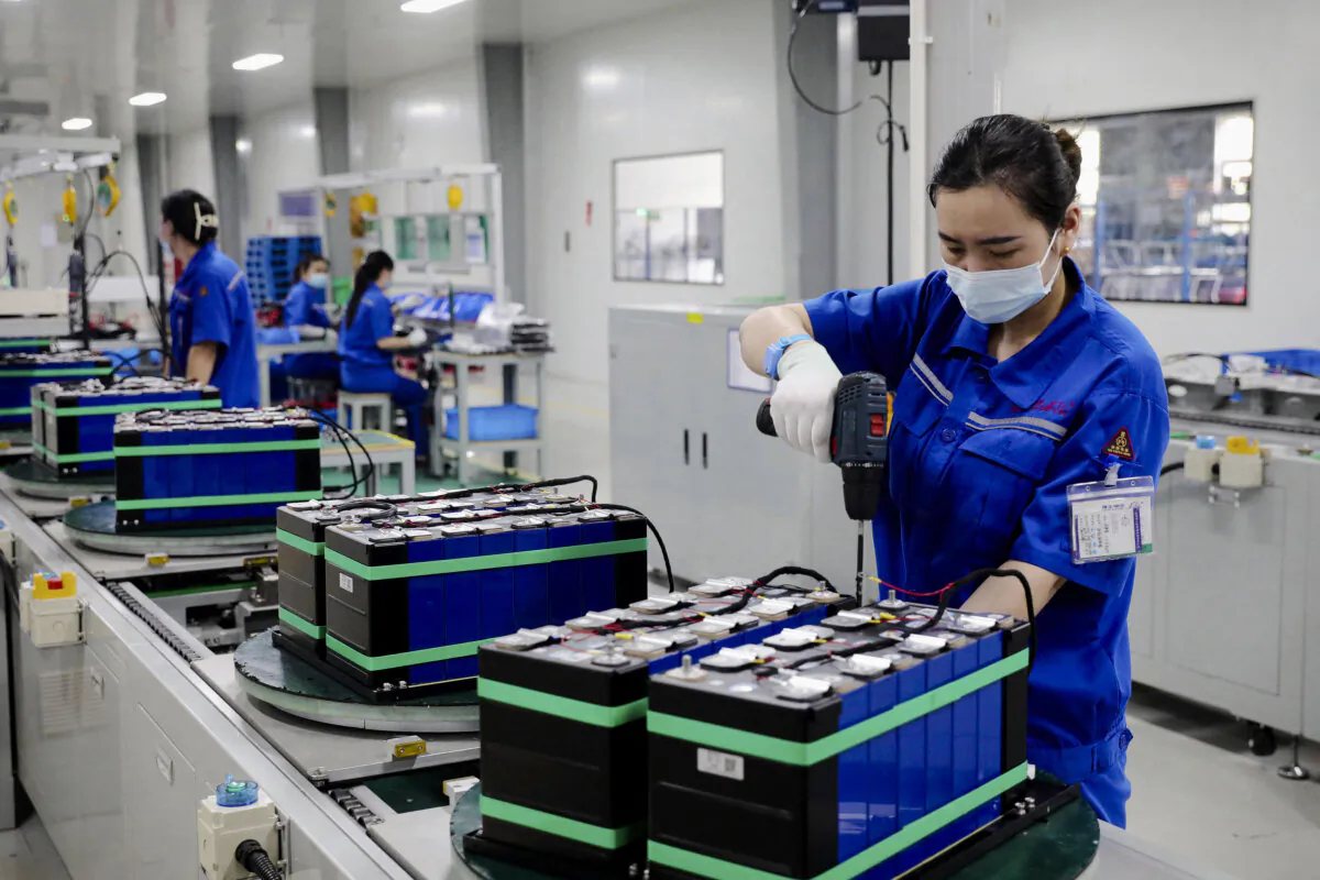 Employees work at a factory that produces lithium batteries for export in Huaibei, Anhui Province, China, on June 11, 2024. (STR/AFP via Getty Images)