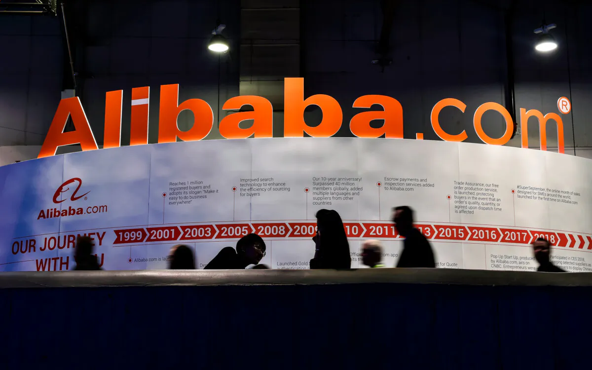 Attendees pass by an Alibaba.com display at CES 2019 at the Las Vegas Convention Center in Las Vegas on Jan. 8, 2019. (David Becker/Getty Images)