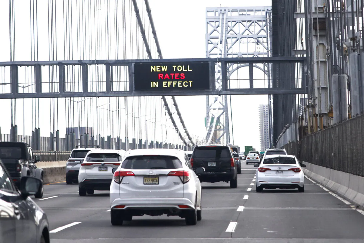 Cars pass under a congestion pricing warning sign on the George Washington Bridge as congestion pricing takes effect in New York City on Jan. 5, 2025. (Kena Betancur/AFP via Getty Images)