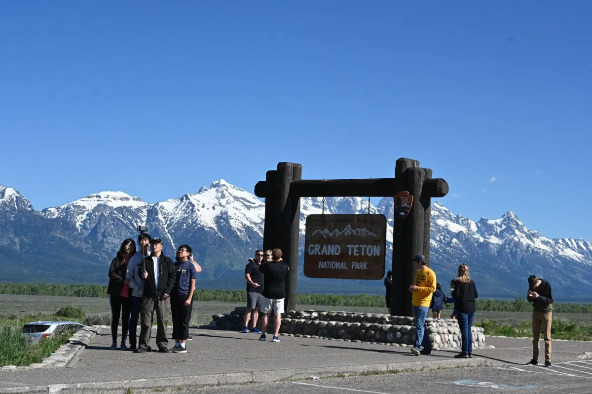 Tourists take photos at Grand Teton National Park, Wyo., on June 13, 2019. (Daniel Slim/AFP via Getty Images)