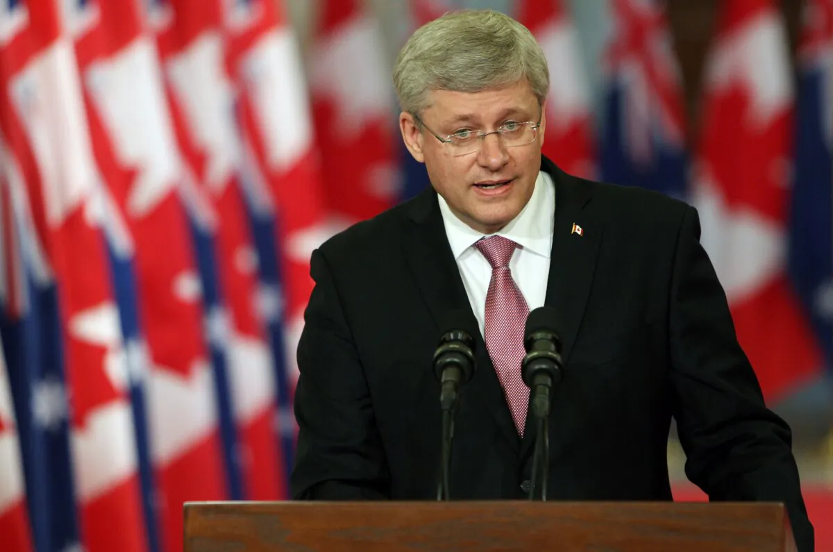 Then-Canadian Prime Minister Stephen Harper addresses media on Parliament Hill in Ottawa on June 9, 2014. (Cole Burston/AFP via Getty Images)
