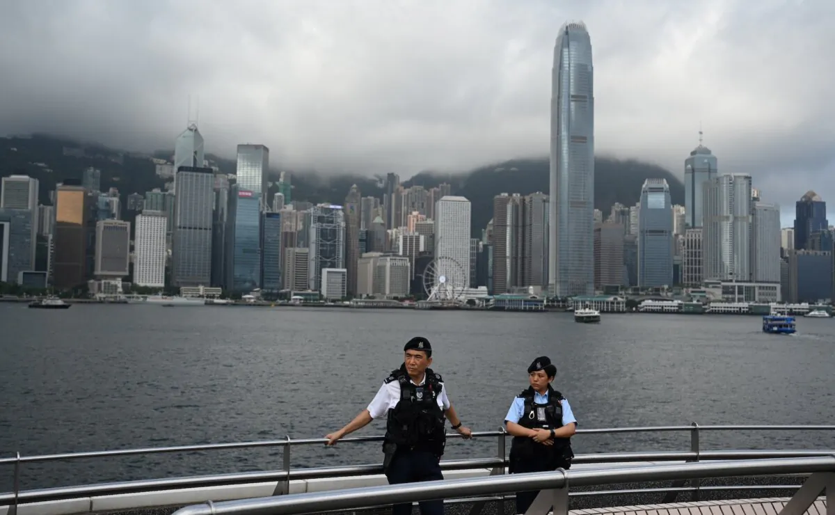 Police keep watch over Hong Kong's Victoria Harbour as the city marks the 27th anniversary of the Handover of Hong Kong from Britain to China on July 1, 2024. (Peter Parks/AFP via Getty Images)