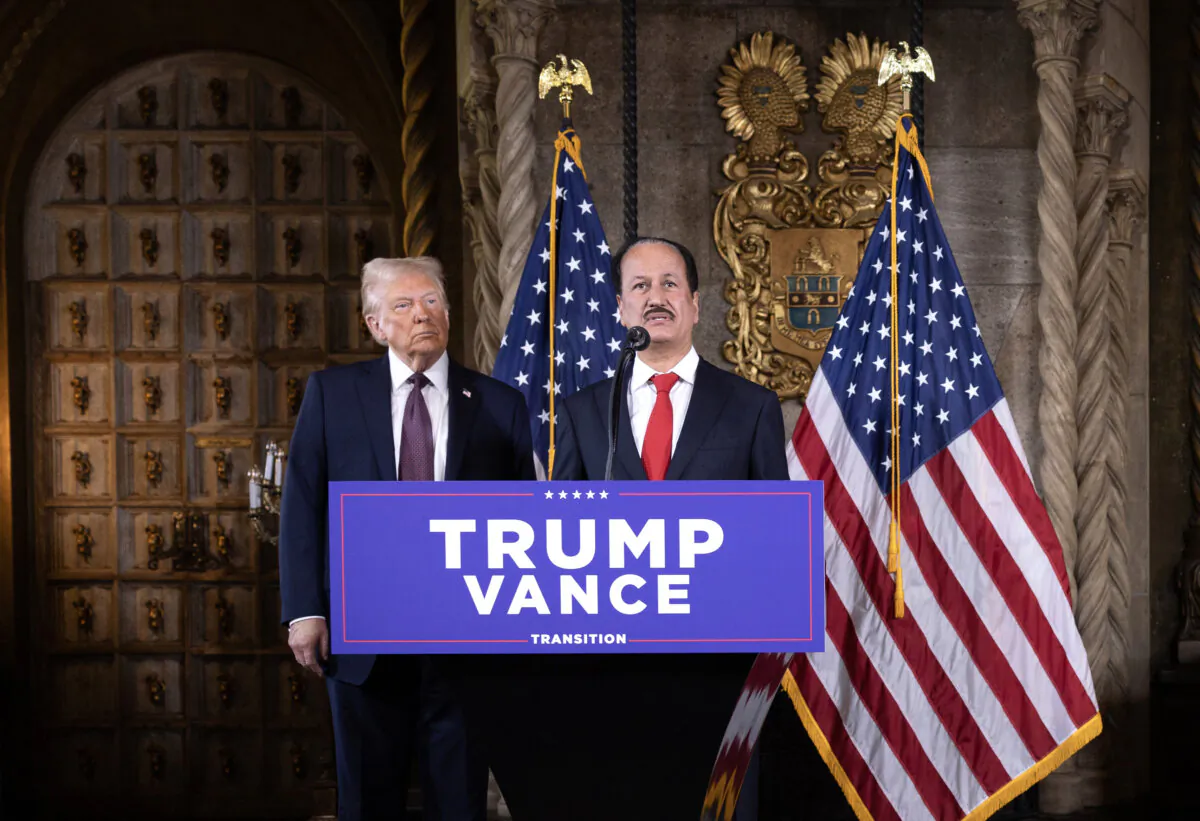 President-elect Donald Trump listens as DAMAC Properties CEO Hussain Sajwani speaks to members of the media during a press conference at the Mar-a-Lago Club in Palm Beach, Fla., on Jan. 7, 2025. (Scott Olson/Getty Images)