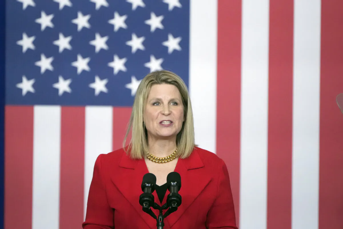 Elizabeth Shuler, president of the AFL-CIO, speaks before President Joe Biden arrives to speak at the Department of Labor in Washington on Dec. 16, 2024. (Mark Schiefelbein/AP Photo)