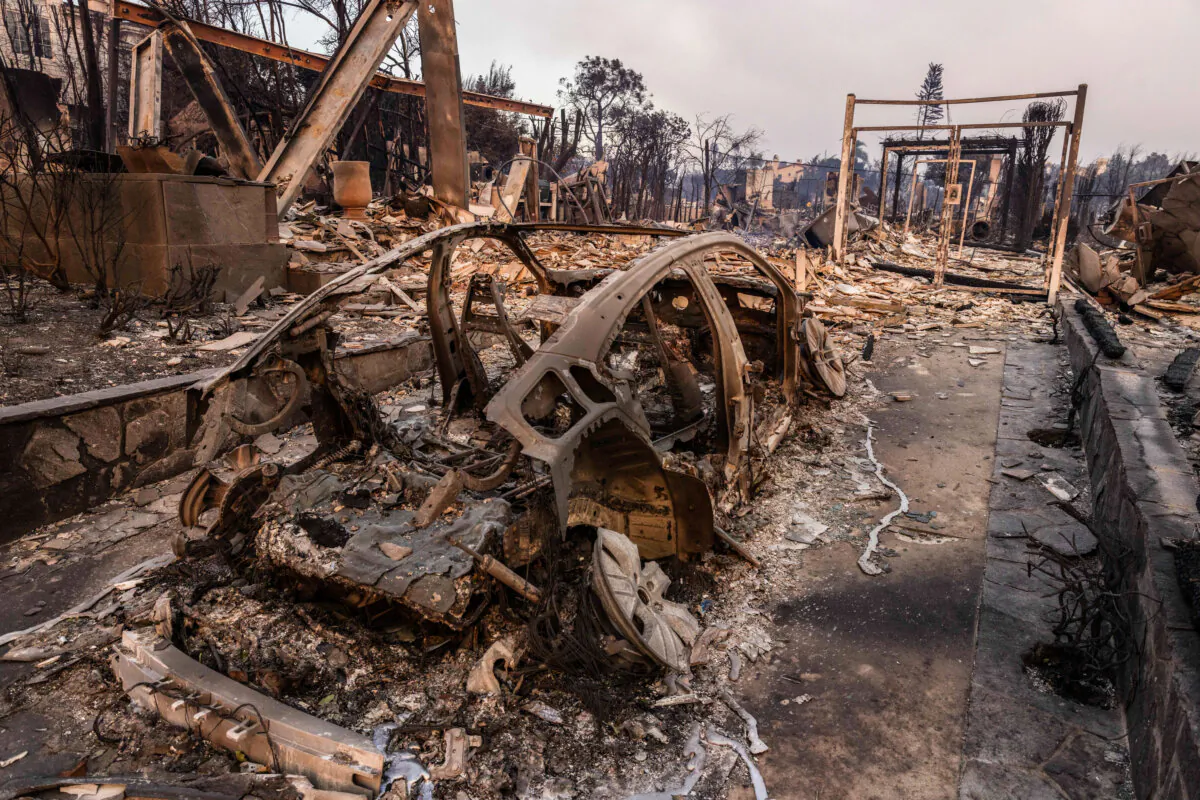 Homes and businesses sit damaged from the Palisades Fire burning near Los Angles, Calif., on Jan. 8, 2025. (John Fredricks/The Epoch Times)