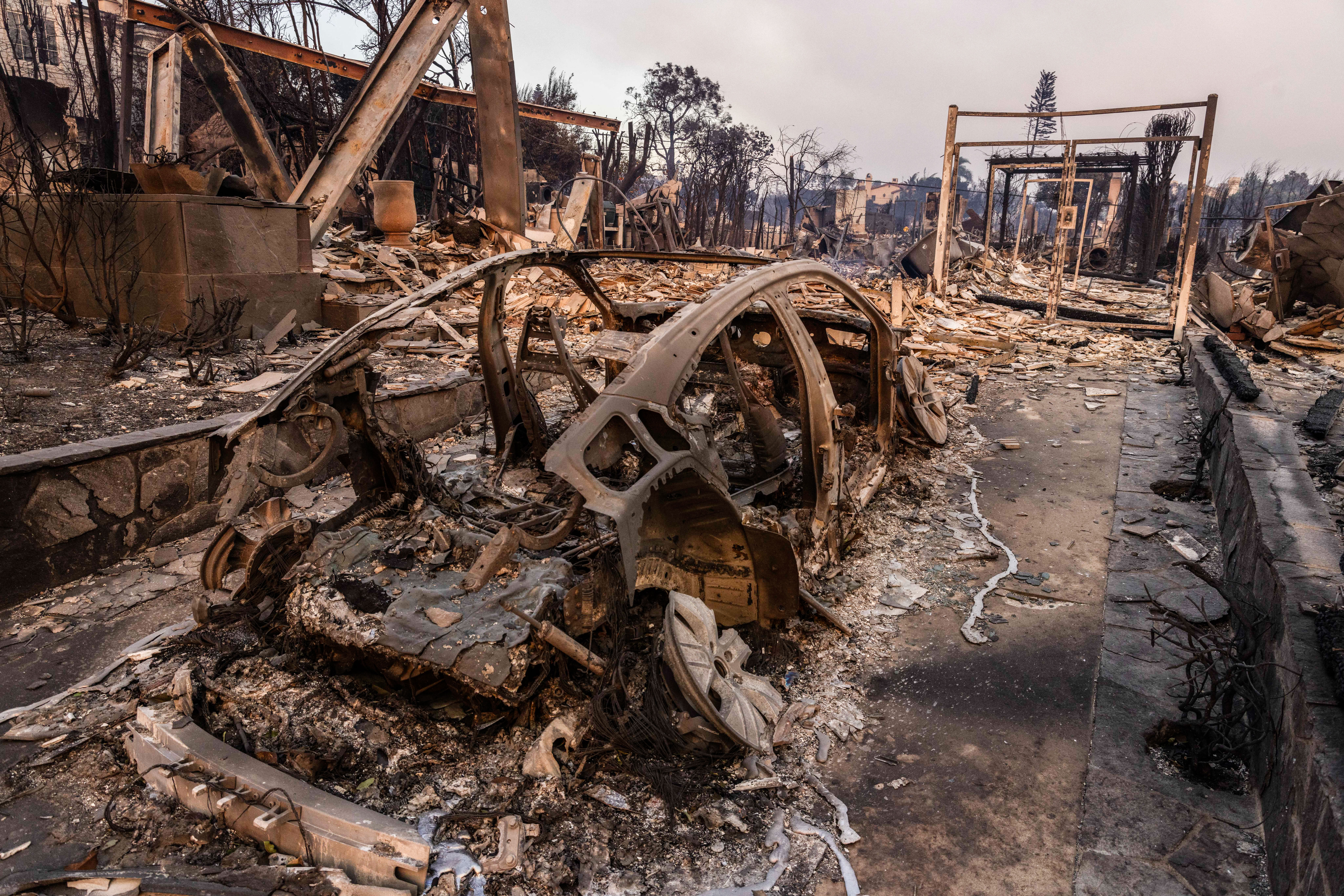 Los Angeles Fires Push Crews to Limits as Critics Blame Government Policy