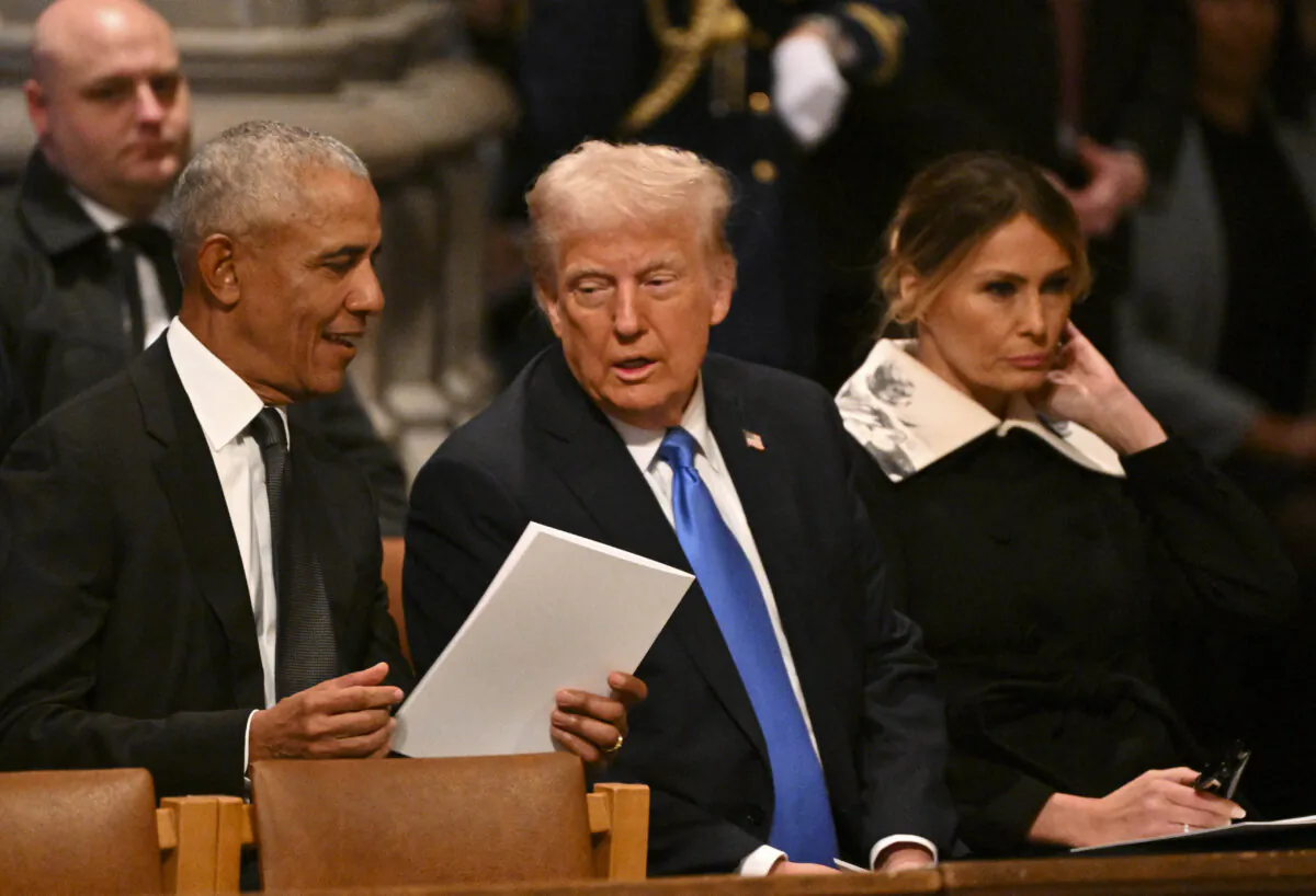 (L-R) Former U.S. President Barack Obama, President-elect Donald Trump and former First Lady Melania Trump arrive to attend the State Funeral Service for former U.S. President Jimmy Carter at the Washington National Cathedral in Washington, on Jan. 9, 2025. (Roberto Schmidt/AFP via Getty Images)
