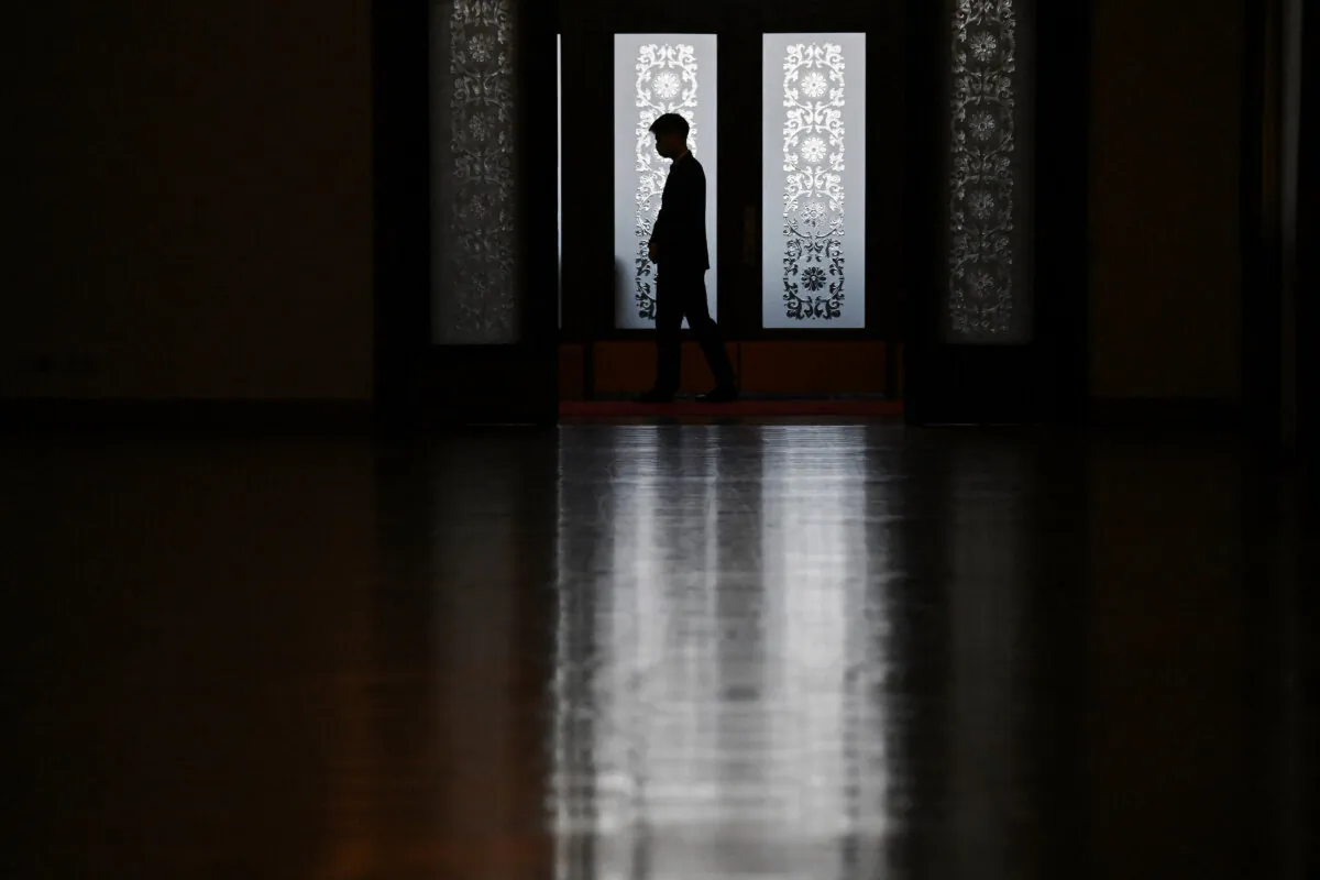 A security guard stands outside a meeting at the National People's Congress (NPC) in Beijing on March 6, 2024. (Greg Baker/AFP)