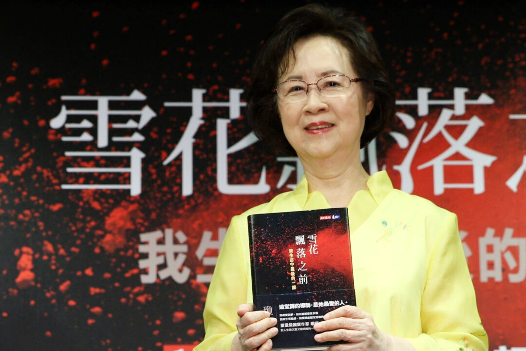 Chiung Yao holds her new book at a book release event in Taipei on Aug 1, 2017. CNA/AFP via Getty Images