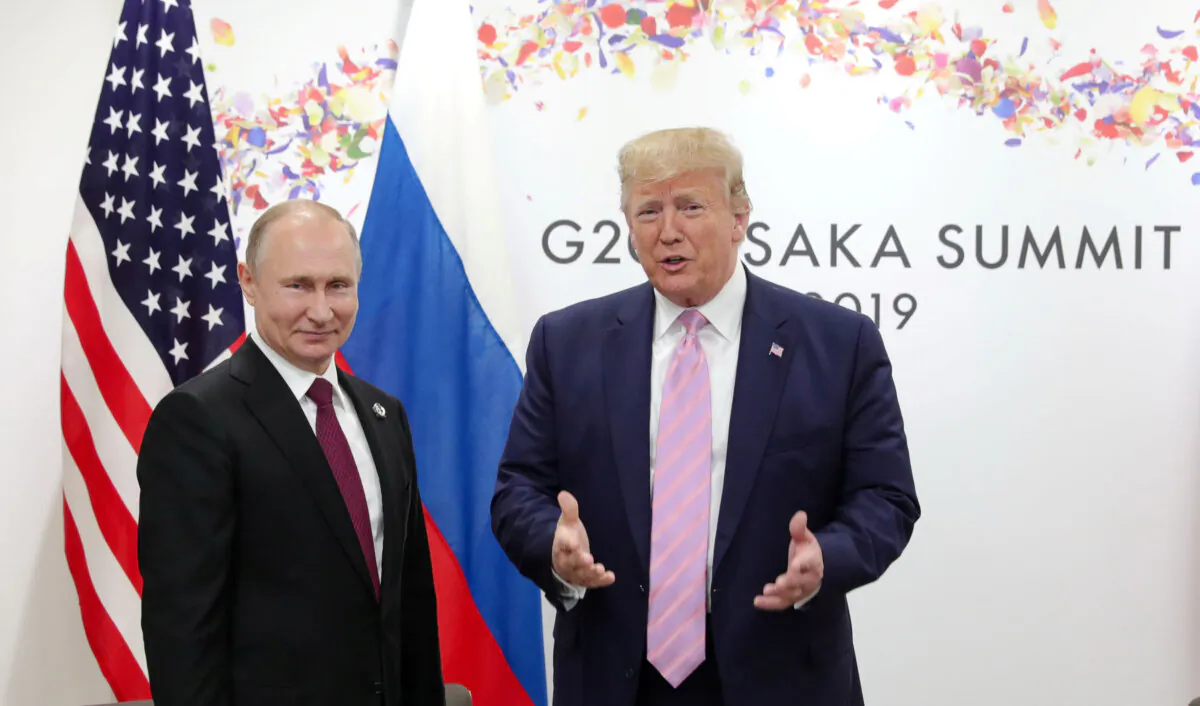 Russian President Vladimir Putin and U.S. President Donald Trump attend a meeting on the sidelines of the G20 summit in Osaka, Japan, on June 28, 2019. (Mikhail Klimentyev/Sputnik via Reuters)