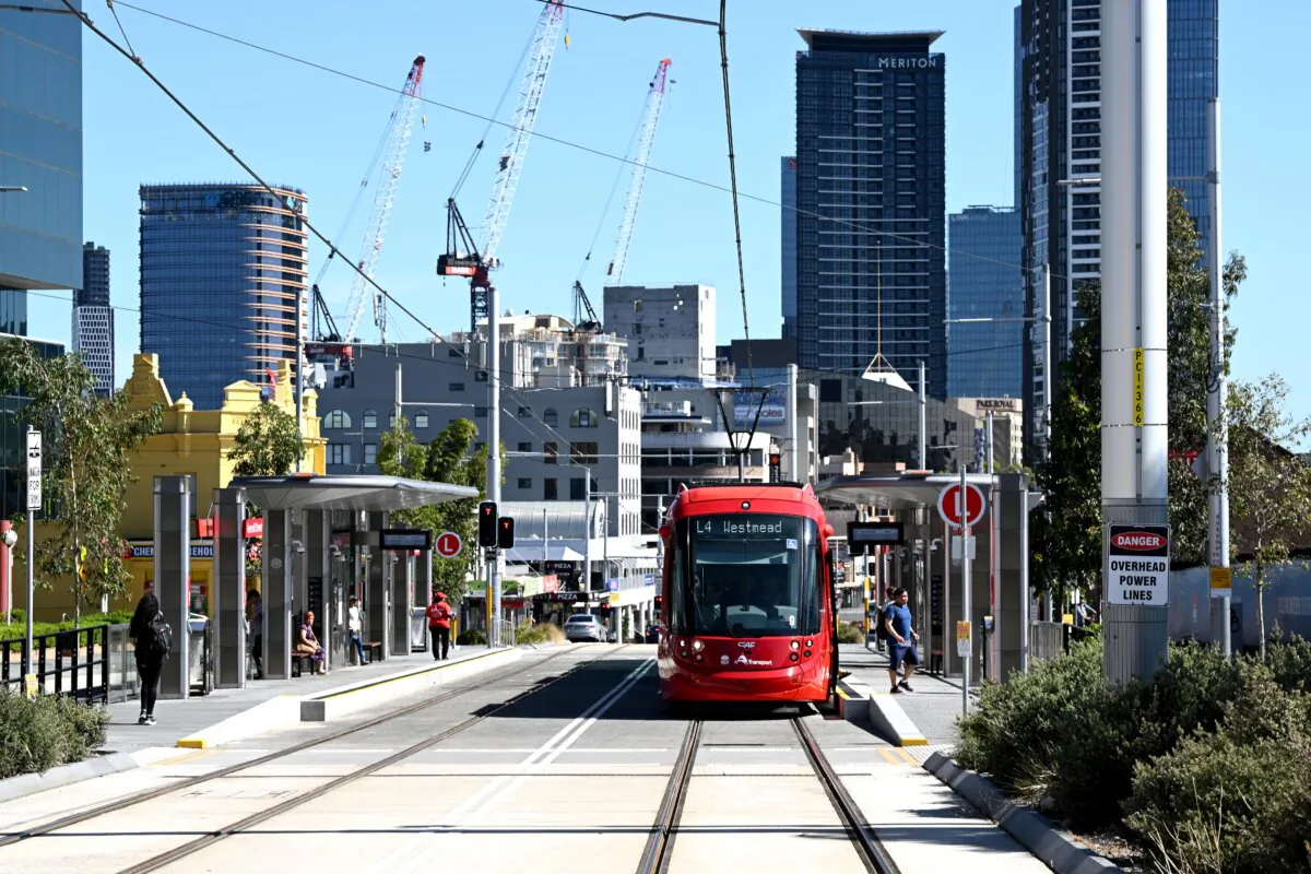 The new Parramatta Light Rail is seen on its first day of service with the Parramatta CBD in the background in western Sydney, Australia on Dec. 20, 2024. (AAP Image/Dan Himbrechts)