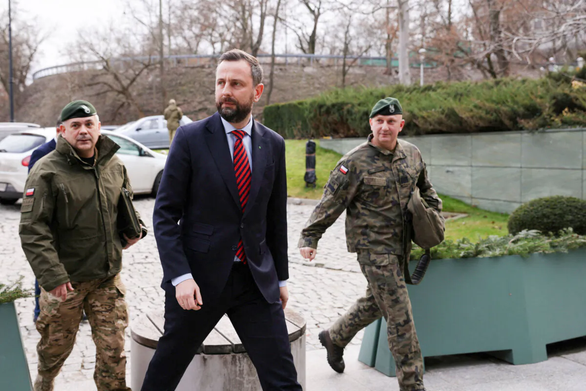 Polish Defense Minister and Deputy Prime Minister Wladyslaw Kosiniak-Kamysz (C), Gen. Maciej Klisz (R), and Gen. Wieslaw Kukula (L) arrive for a National Security Council meeting in Warsaw, Poland, on Dec. 29, 2023. (Dawid Zuchowicz/Agencja Wyborcza.pl via Reuters)
