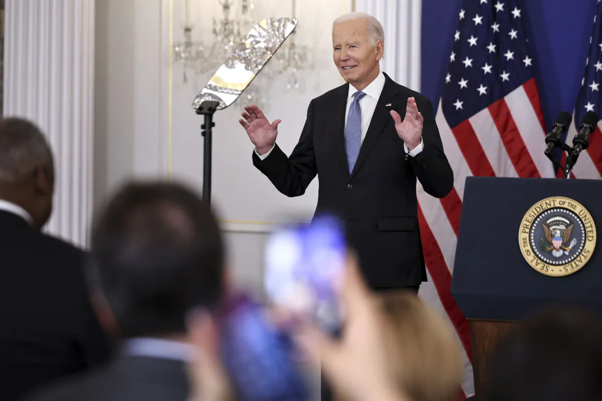 President Joe Biden reacts to a standing ovation as he arrived to deliver a speech about his foreign policy achievements at the State Department's headquarters building on Jan. 13, 2025, in Washington. (Chip Somodevilla/Getty Images)