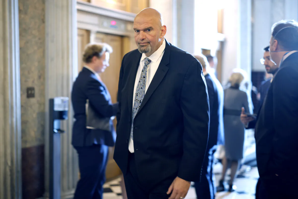 Sen. John Fetterman (D-Pa.) heads to the Senate chamber for a vote at the U.S. Capitol on May 10, 2023. (Chip Somodevilla/Getty Images)
