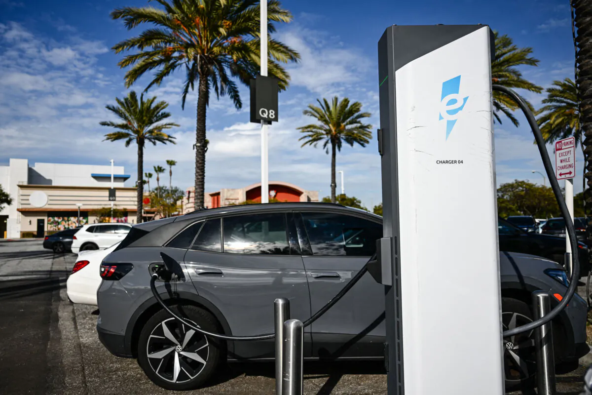 A Volkswagen ID.4 electric vehicle charges at a shopping mall parking lot in Torrance, Calif. (Patrick T. Fallon / AFP via Getty Images)
