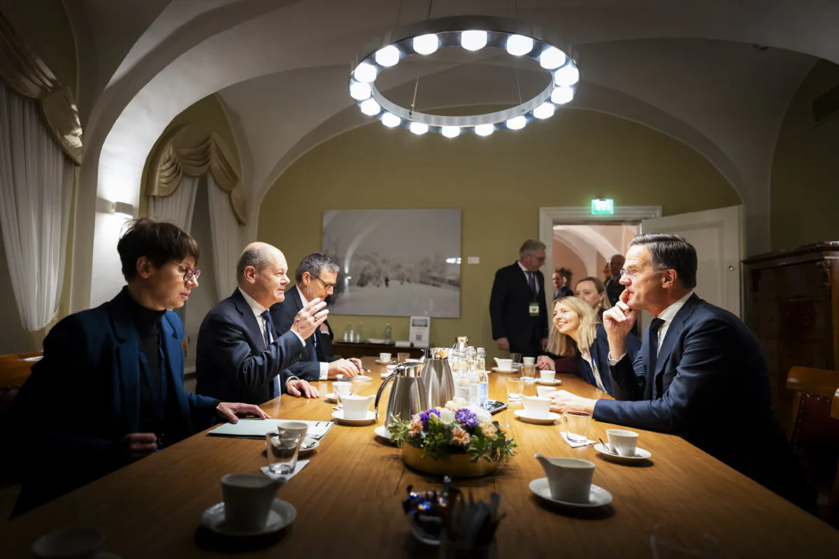 Germany Chancellor Olaf Scholz (2nd L) talks with NATO Secretary General Mark Rutte (R), along with his office manager, Jeanette Schwamberger (L), and his adviser on foreign and security policy, Jens Plötner (3rd L), during the Baltic Sea NATO Allies Summit in Helsinki on Jan. 14, 2025. (Steffen Kugler/Bundesregierung via Getty Images)
