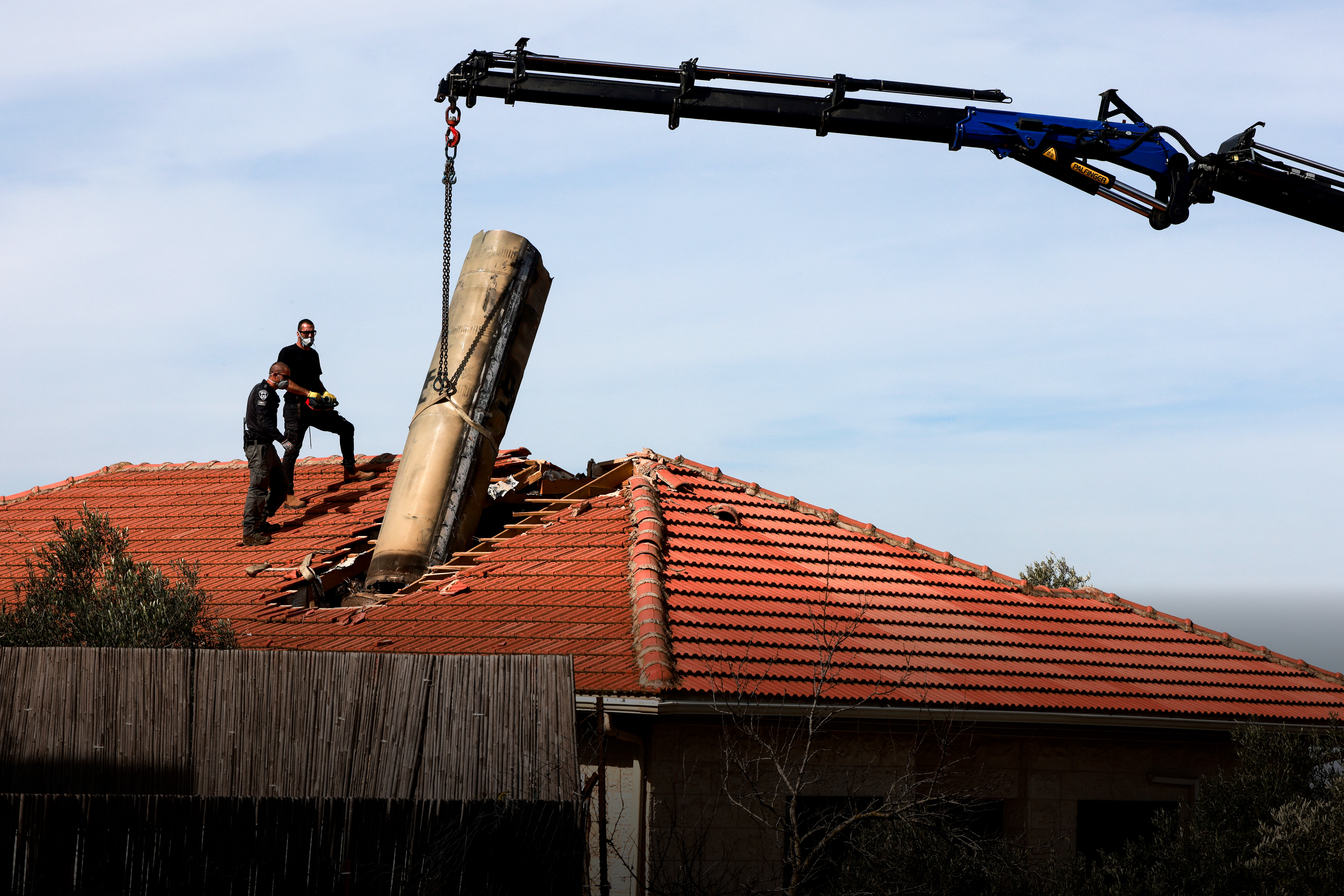 Day in Photos: A Rocket on a Roof in Israel, Hearings on the Secretary of Defense, and Rescuing Illegal Miners