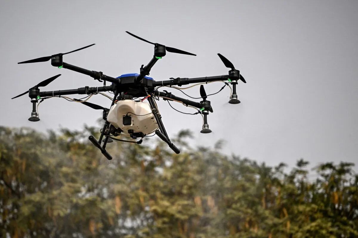 An aerial drone sprays water mist, which is tasked with flying around the city's pollution hotspots to clear dust and harmful particulate matter from the air, in New Delhi, India, on Nov. 8, 2024. (Arun Sankar/AFP via Getty Images)