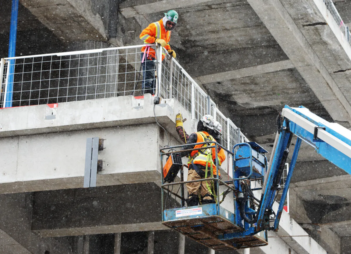 Men work at a construction site in Montreal in a file photo.  (The Canadian Press/Ryan Remiorz)