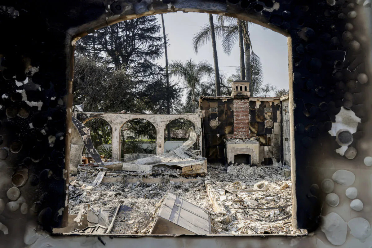 The charred remains of a home can be seen off Braeburn Road in Altadena, Calif., on Jan. 10, 2024. (Brontë Wittpenn/San Francisco Chronicle via AP)