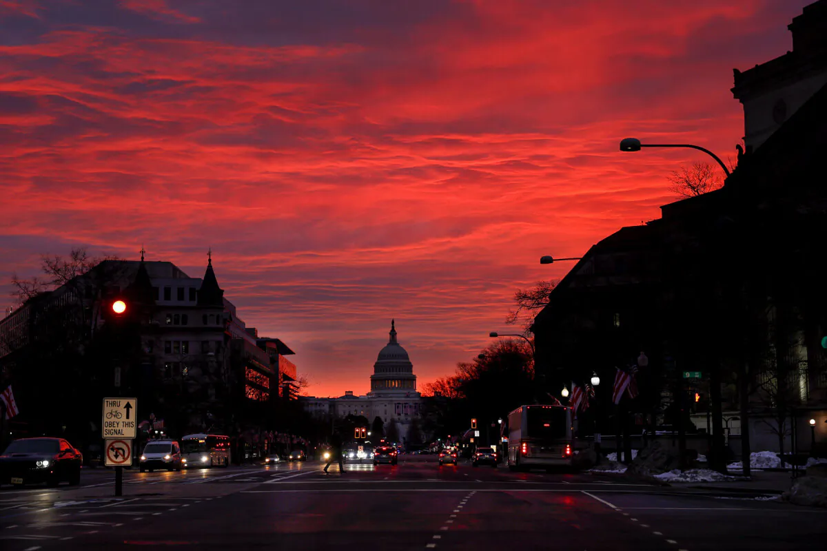 The sun rises behind the U.S. Capitol on Jan. 16, 2025. (Anna Moneymaker/Getty Images)