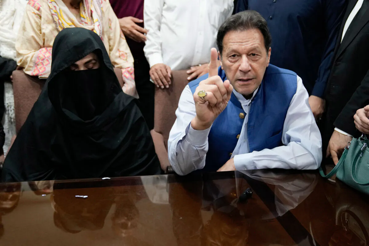 Former Pakistani Prime Minister Imran Khan (R) and Bushra Bibi, his wife, in an office of Lahore High Court in Lahore, Pakistan, on Jul. 17, 2023. (K.M. Chaudary/AP Photo, File))