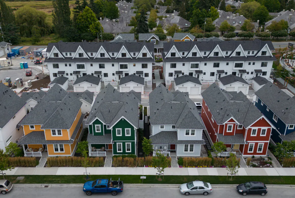 New single family houses billed as estate cottages and townhouses under construction are seen in an aerial view, in Delta, B.C., on Aug. 12, 2024. (The Canadian Press/Darryl Dyck) 