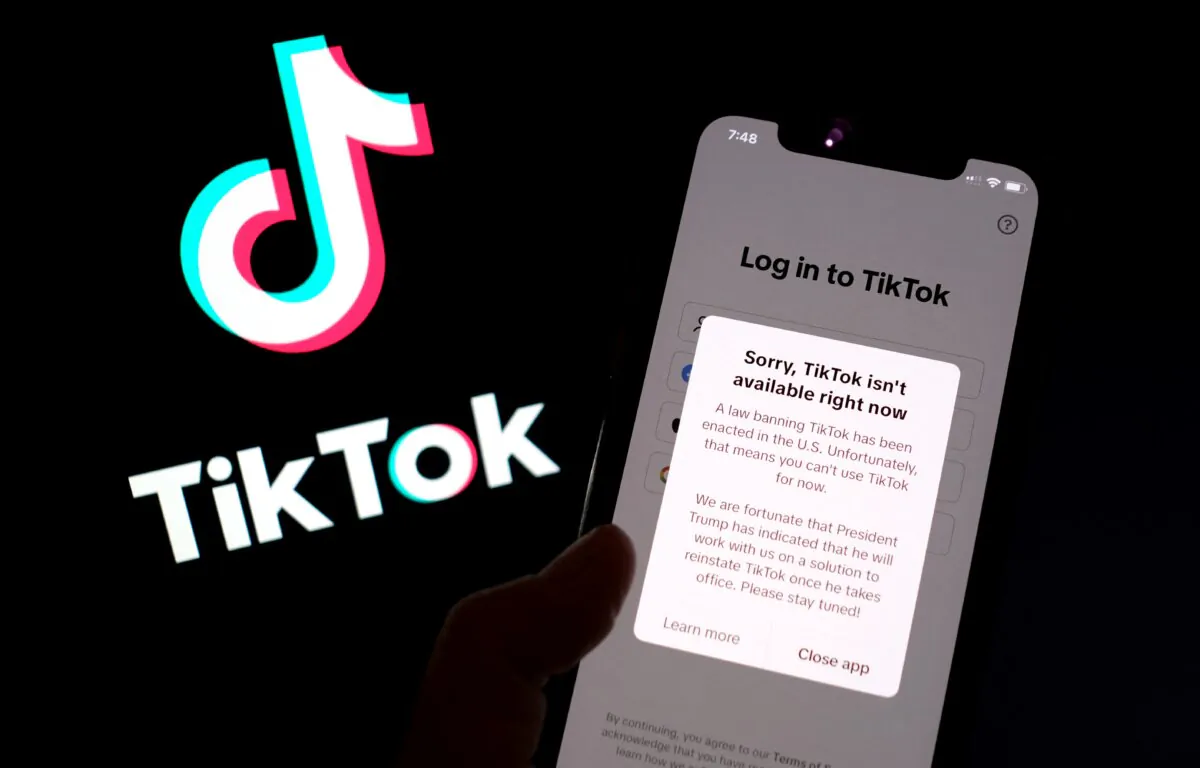 The TikTok app on a smartphone screen in front of the TikTok logo in Los Angeles on Jan. 18, 2025. (Chris Delmas/AFP via Getty Images)