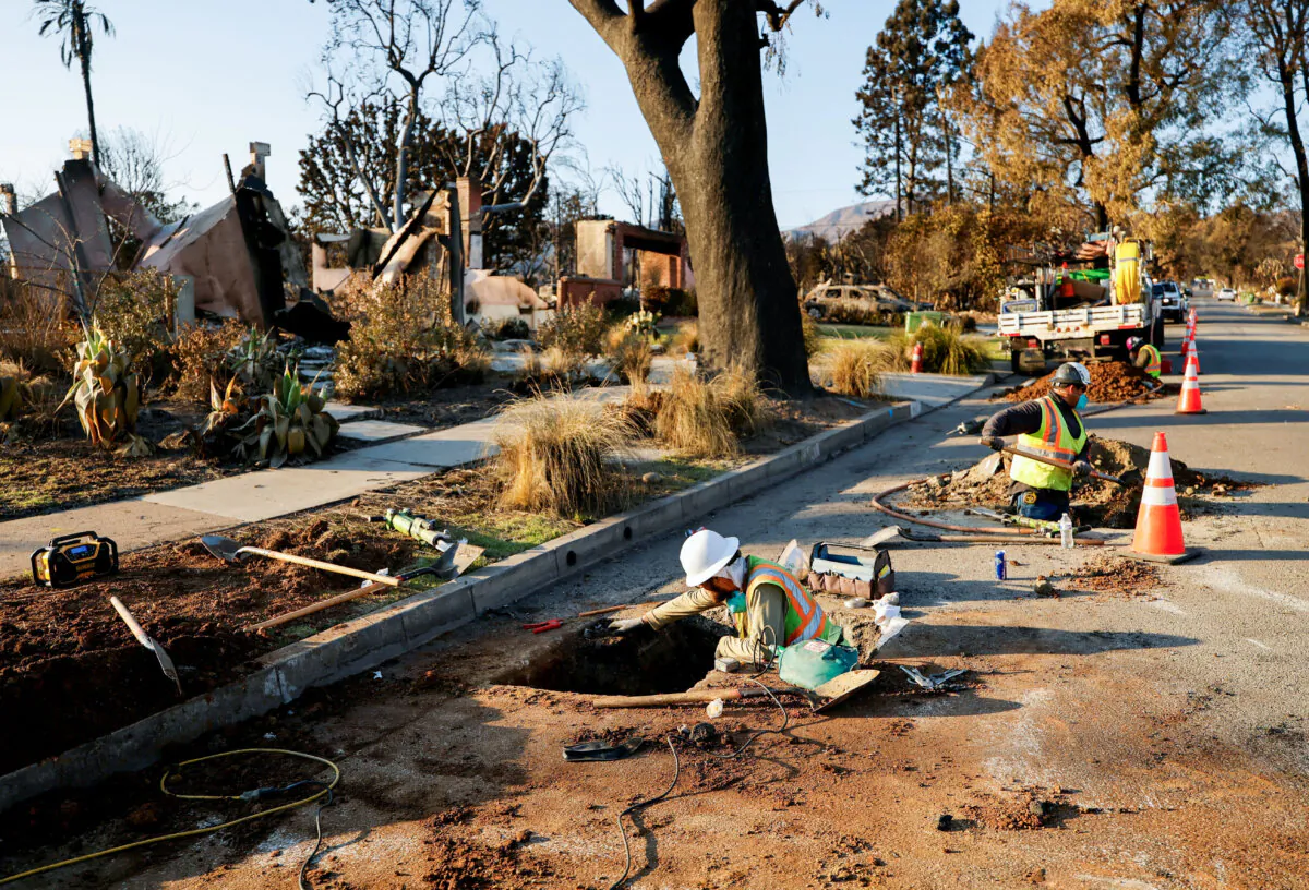 Utility workers restore a gas line near homes burned by the Palisades Fire, in Pacific Palisades, Calif., on Jan. 17, 2025. (Fred Greaves /Reuters)