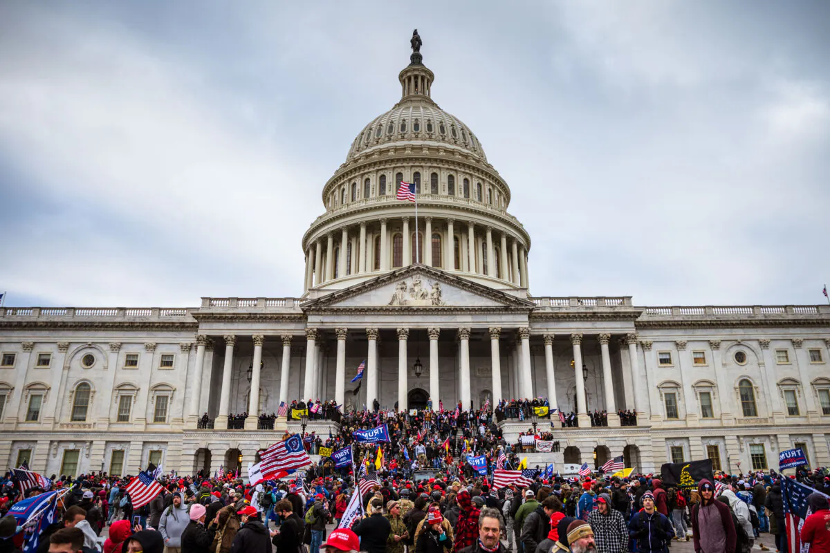 A large group of protesters gather on the East steps of the Capitol Building shortly after the breach in Washington on Jan. 6, 2021. (Jon Cherry/Getty Images)