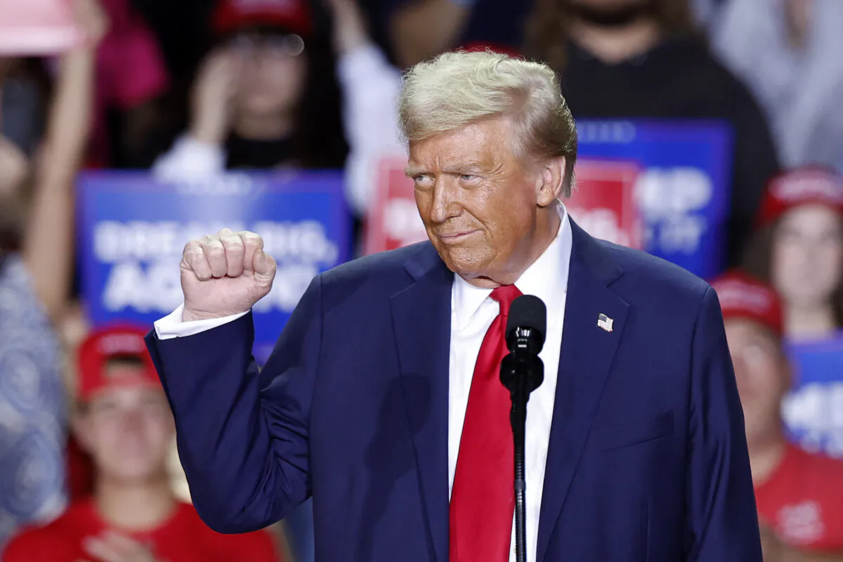 Former President and Republican presidential candidate Donald Trump gestures as he speaks during a campaign rally at Van Andel Arena in Grand Rapids, Mich., on Nov. 5, 2024. (Kamil Krzaczynski/AFP via Getty Images)