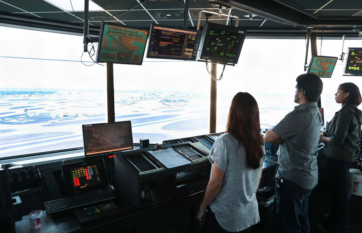 Air traffic controllers keep watch using Data Comm, part of the FAA's Next Generation Air Transportation system, in the control tower at Miami International Airport on March 6, 2017. (Joe Raedle/Getty Images)