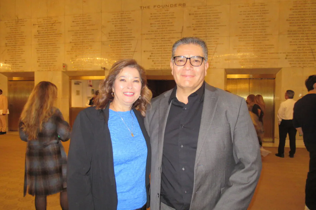 Susie Leyva and husband Felix Leyva and the Dorothy Chandler Theater in Los Angeles, California, on Jan. 18. 2025. (The Epoch Times)