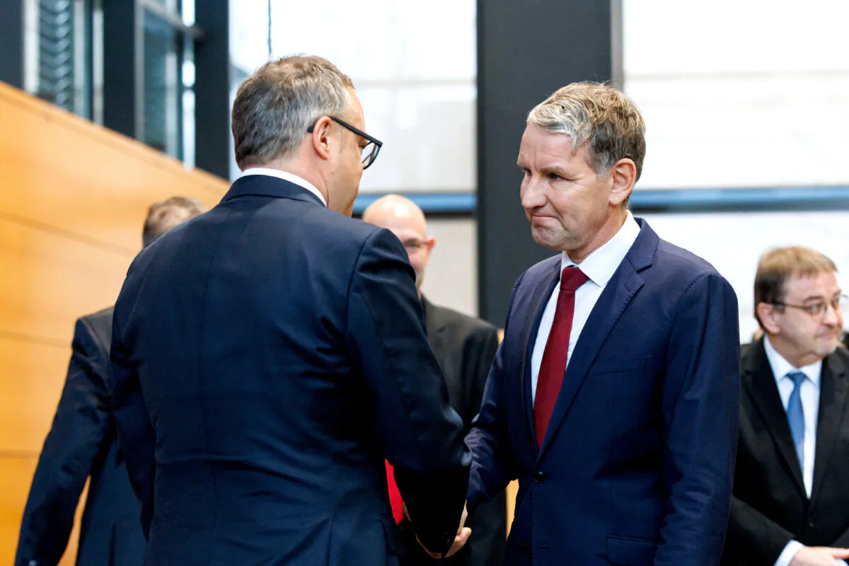 Thuringia's new State Premier Mario Voigt (L) shakes hands with Bjoern Hoecke, regional leader of the Alternative for Germany (AfD) party in Thuringia, after Voigt was sworn in at the Thuringian state Parliament in Erfurt, eastern Germany on Dec. 12, 2024. (Jens Schlueter/AFP via Getty Images)