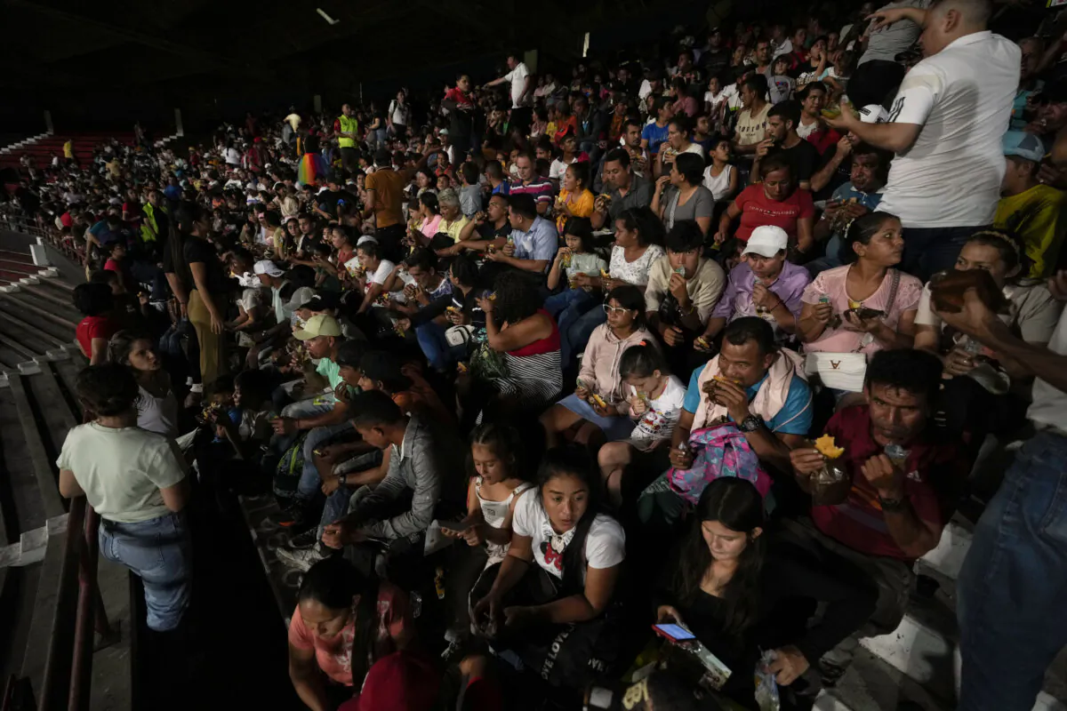 People displaced by violence in towns across the Catatumbo region take shelter at a soccer stadium in Cúcuta, Colombia, on Jan. 19, 2025. (Fernando Vergara/AP Photo)