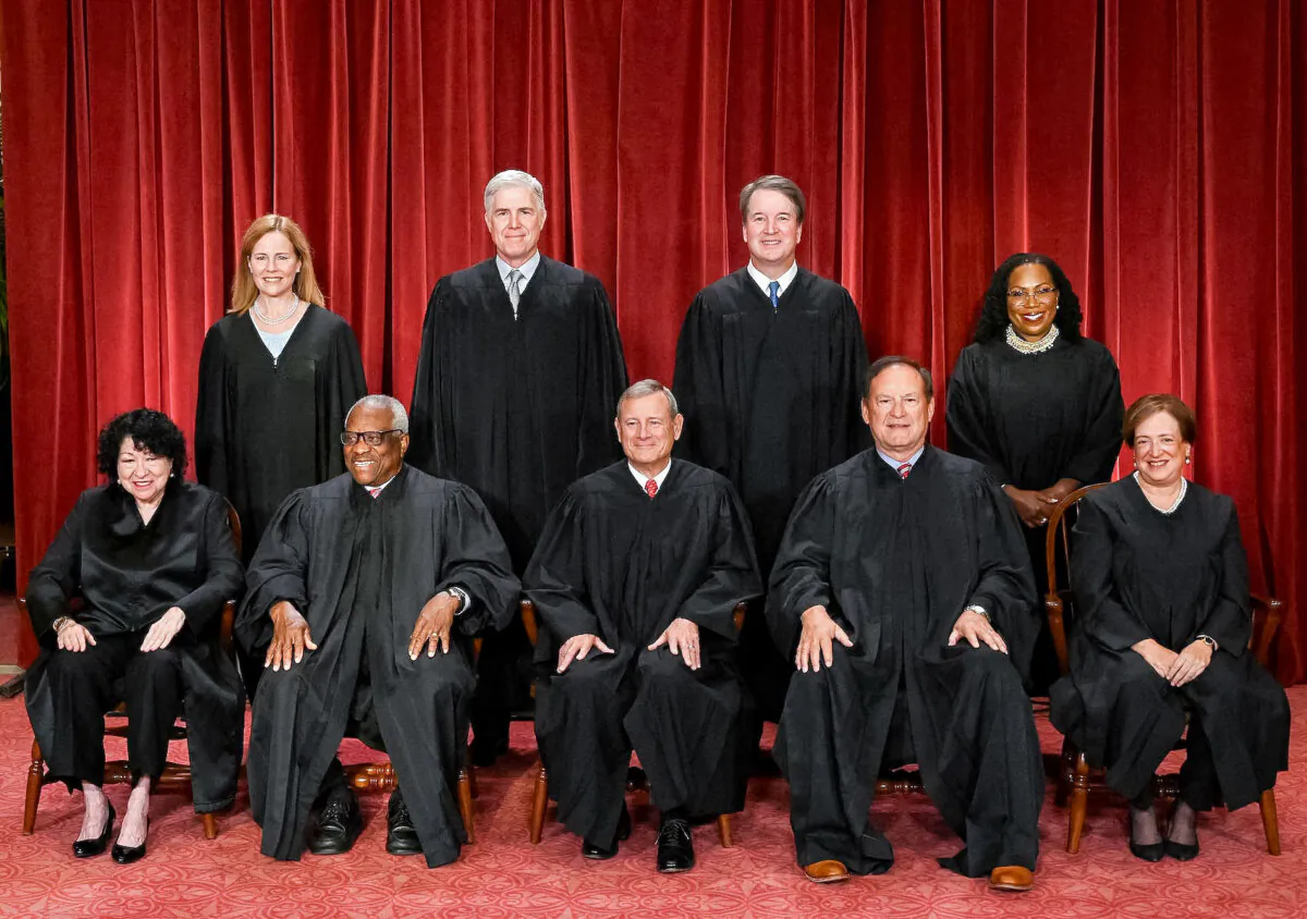 Justices of the Supreme Court pose for their official photo at the Supreme Court in Washington on Oct. 7, 2022. (Front L–R) Justices Sonia Sotomayor and Clarence Thomas, Chief Justice John Roberts, Justice Samuel Alito, and Justice Elena Kagan. (Back L–R) Justices Amy Coney Barrett, Neil Gorsuch, Brett Kavanaugh, and Ketanji Brown Jackson. (Olivier Douliery/AFP via Getty Images)