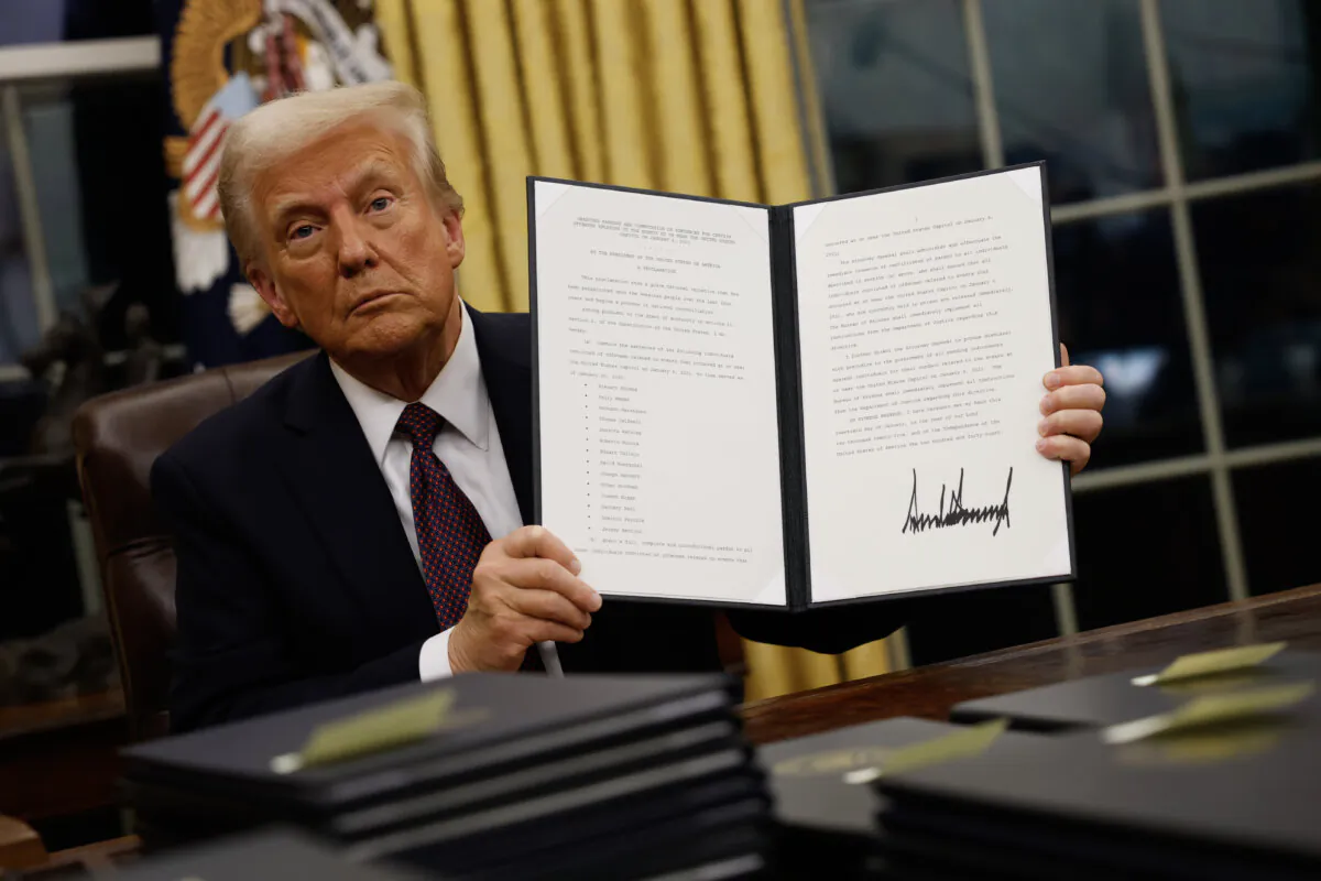 President Donald Trump signs executive orders in the Oval Office on Jan. 20, 2025. (Anna Moneymaker/Getty Images)