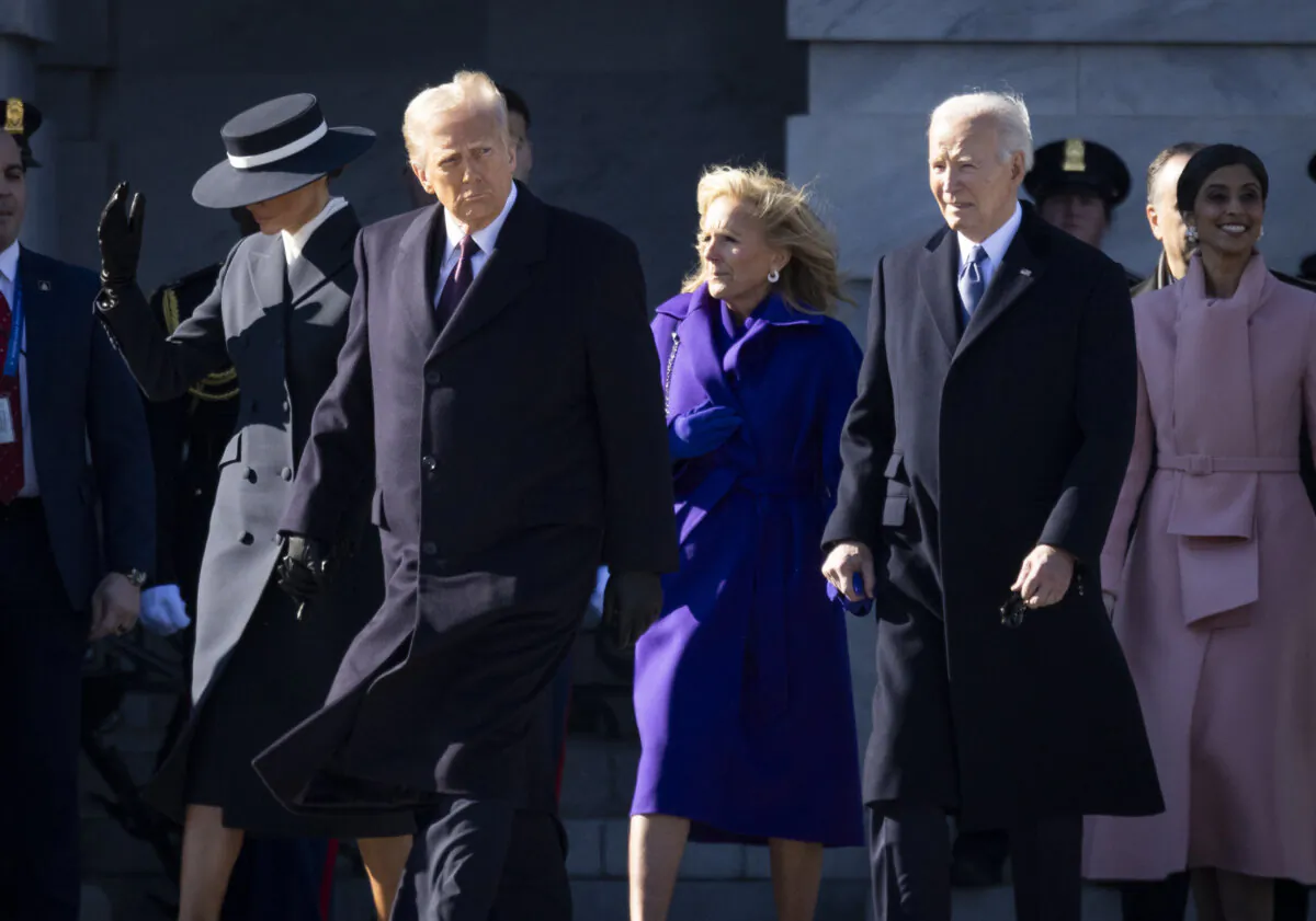 President Donald Trump and former President Joe Biden walk together to the "Marine One" helipad in Washington D.C, on Jan. 20, 2025. (John Fredricks/The Epoch Times)