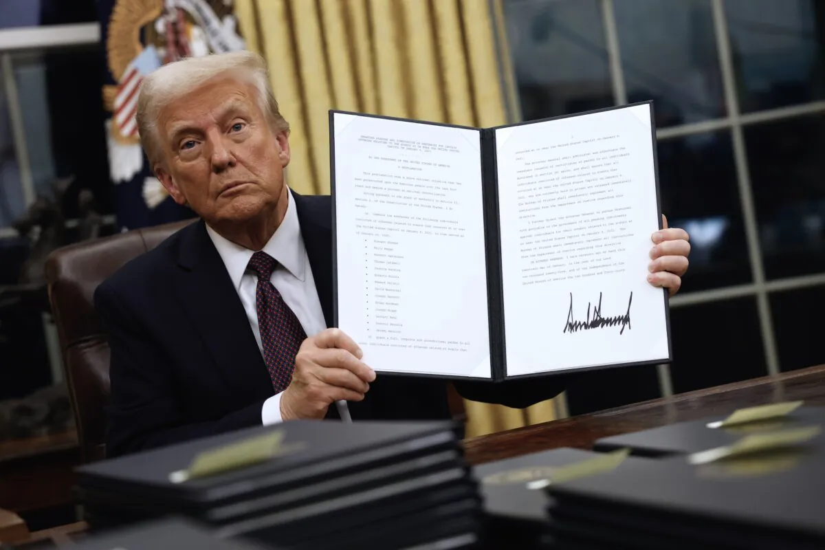 President Donald Trump signs executive orders in the Oval Office in Washington on Jan. 20, 2025. (Anna Moneymaker/Getty Images)