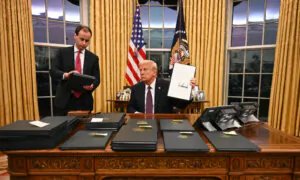 Trump Signs Executive Orders Halting Biden Policies; 2 Americans Freed After Prisoner Exchange