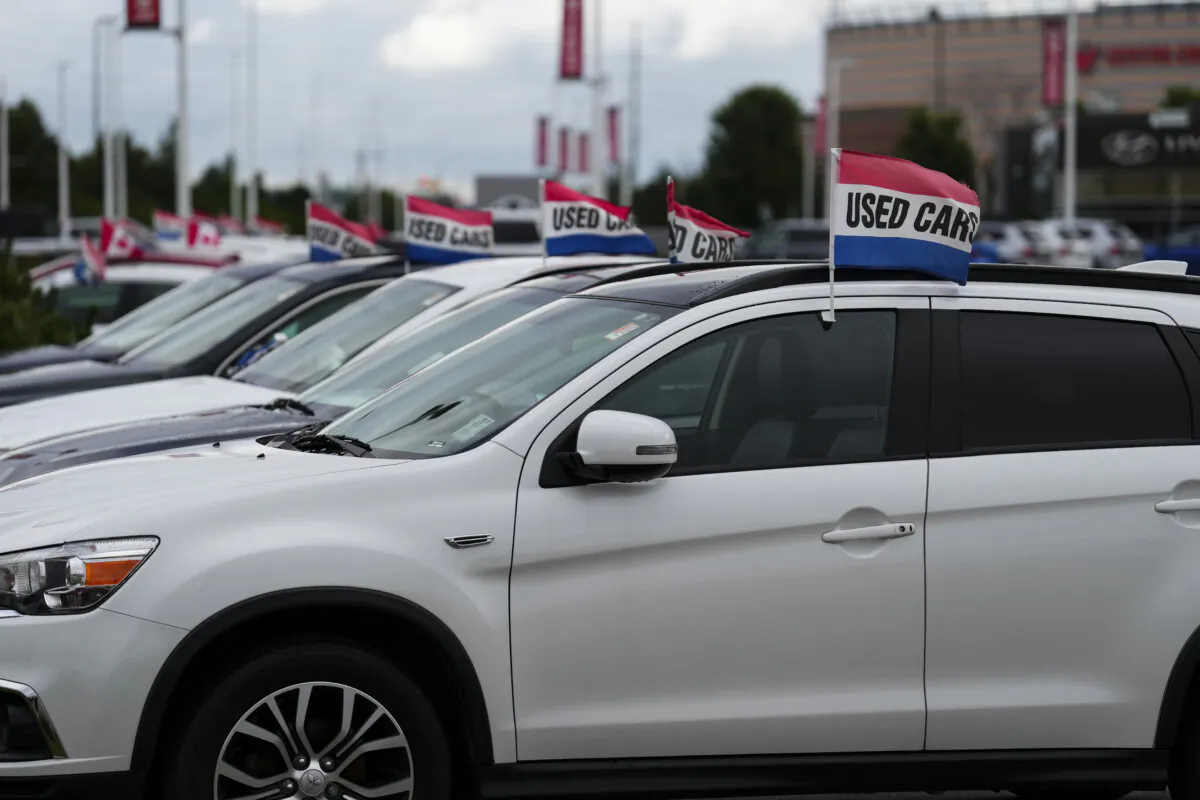 Used vehicles for sale are displayed at an automotive dealership in Ottawa on Aug. 11, 2023. (The Canadian Press/Sean Kilpatrick)