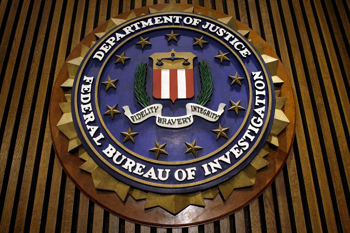 The seal of the FBI hangs in the Flag Room at the bureau's headquarters in Washington on March 9, 2007. (Chip Somodevilla/Getty Images)